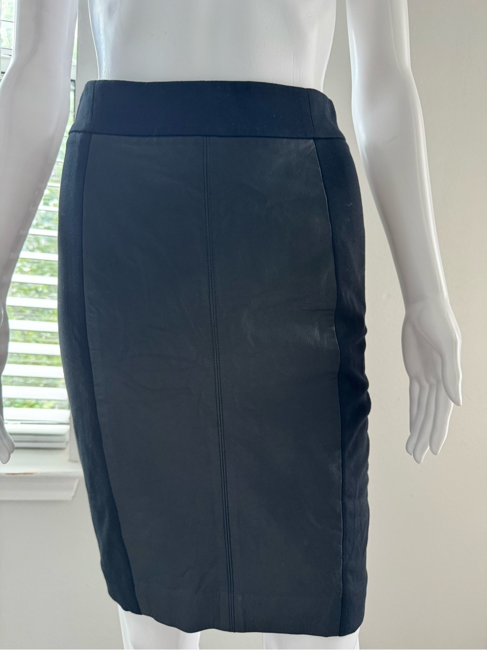 DKNY leather-panel pencil skirt. This style combines contrasting textures: the f